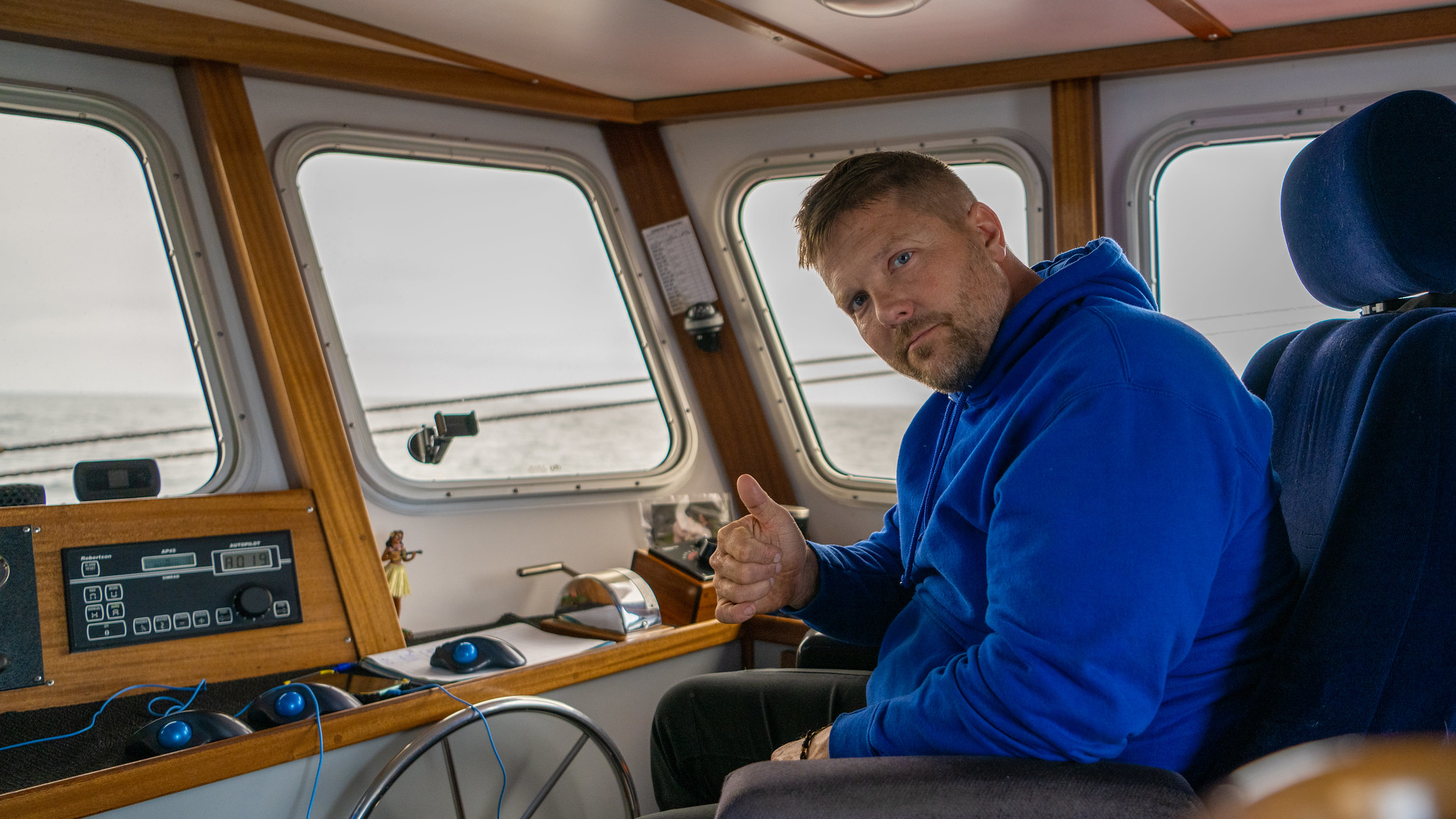Captain Michael Retherford in the wheelhouse of the FV Winona J