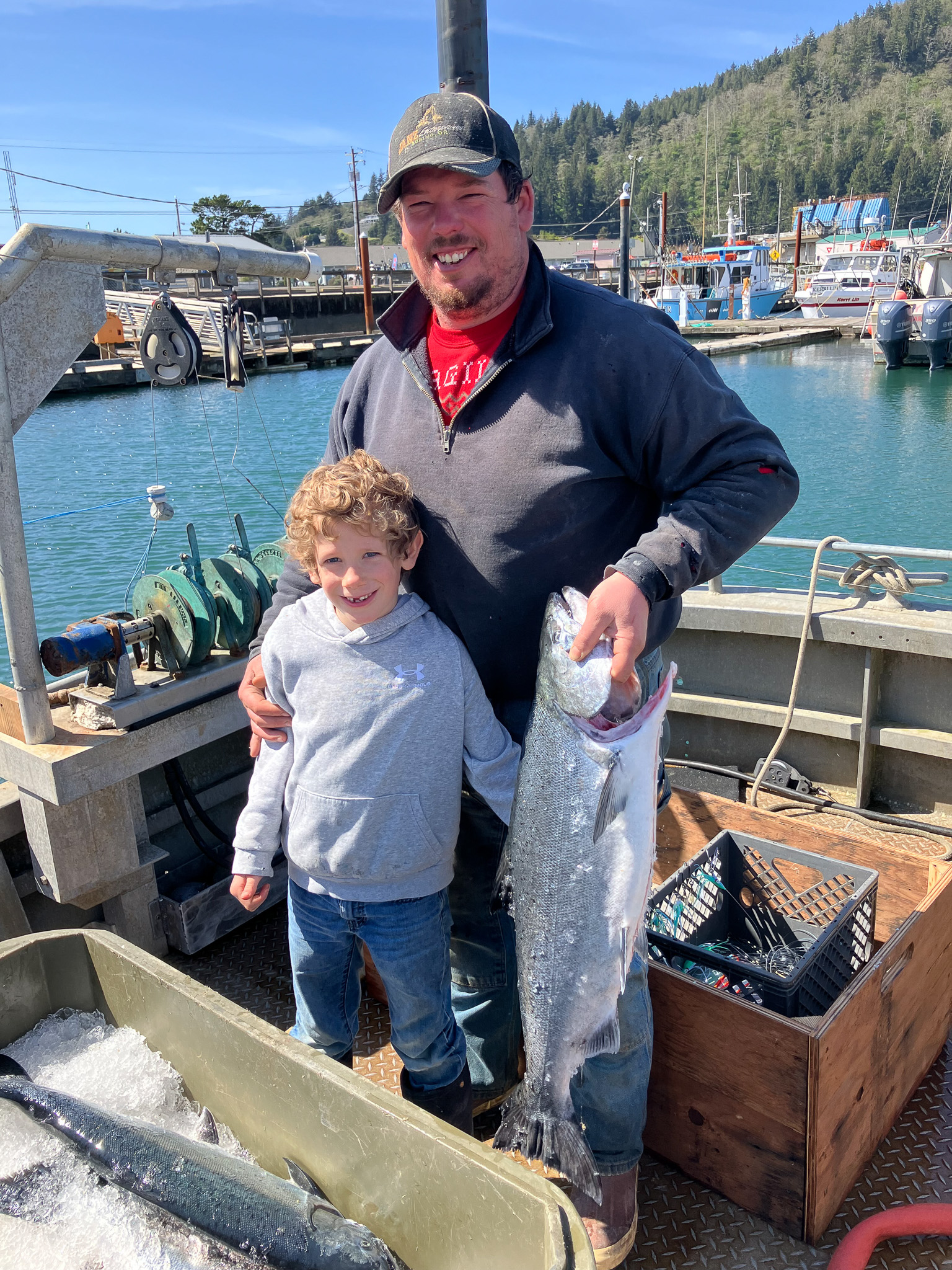 Willie McDonald and his son on his fishing vessel F/V April