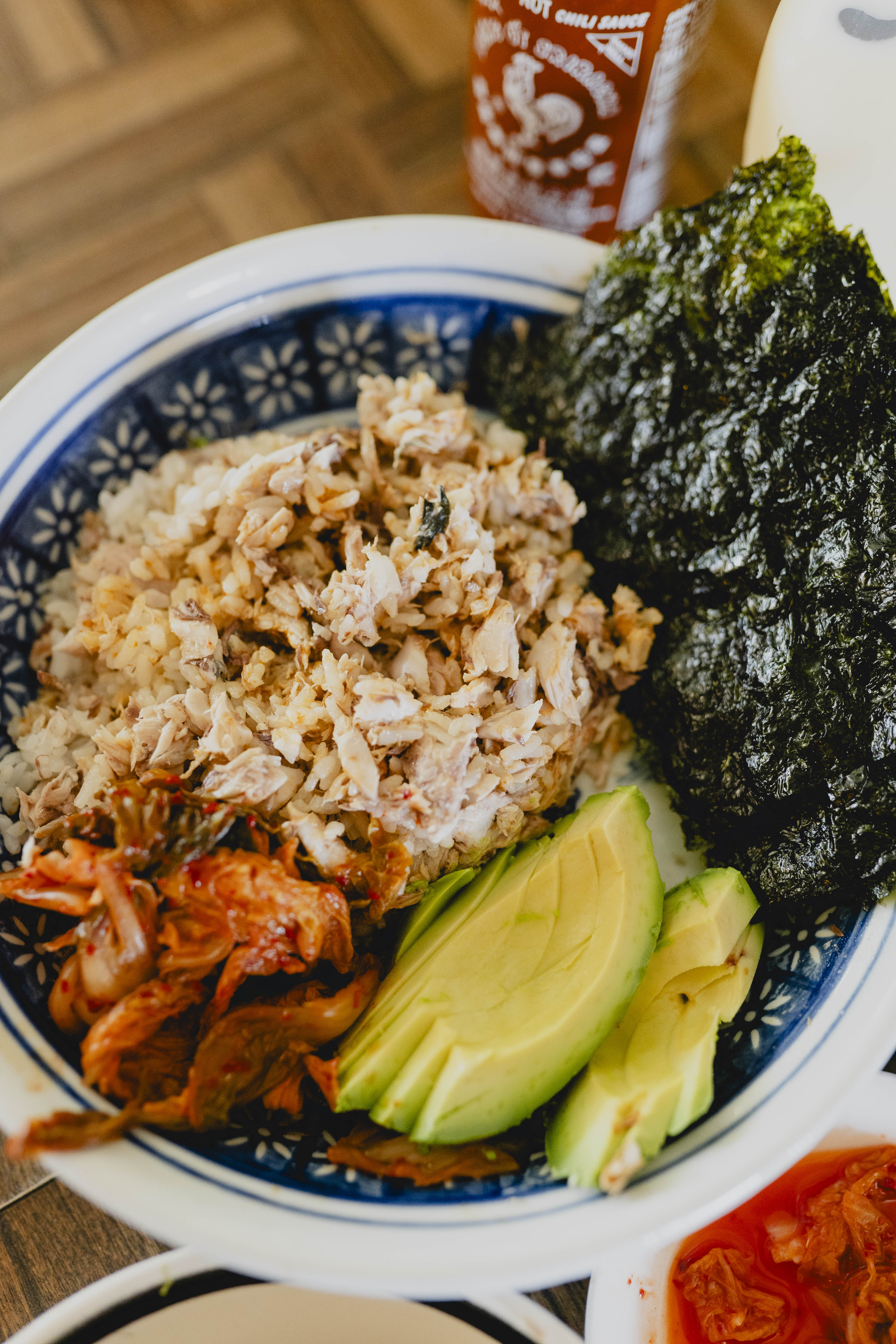 mackerel rice in a bowl with seaweed and avocado