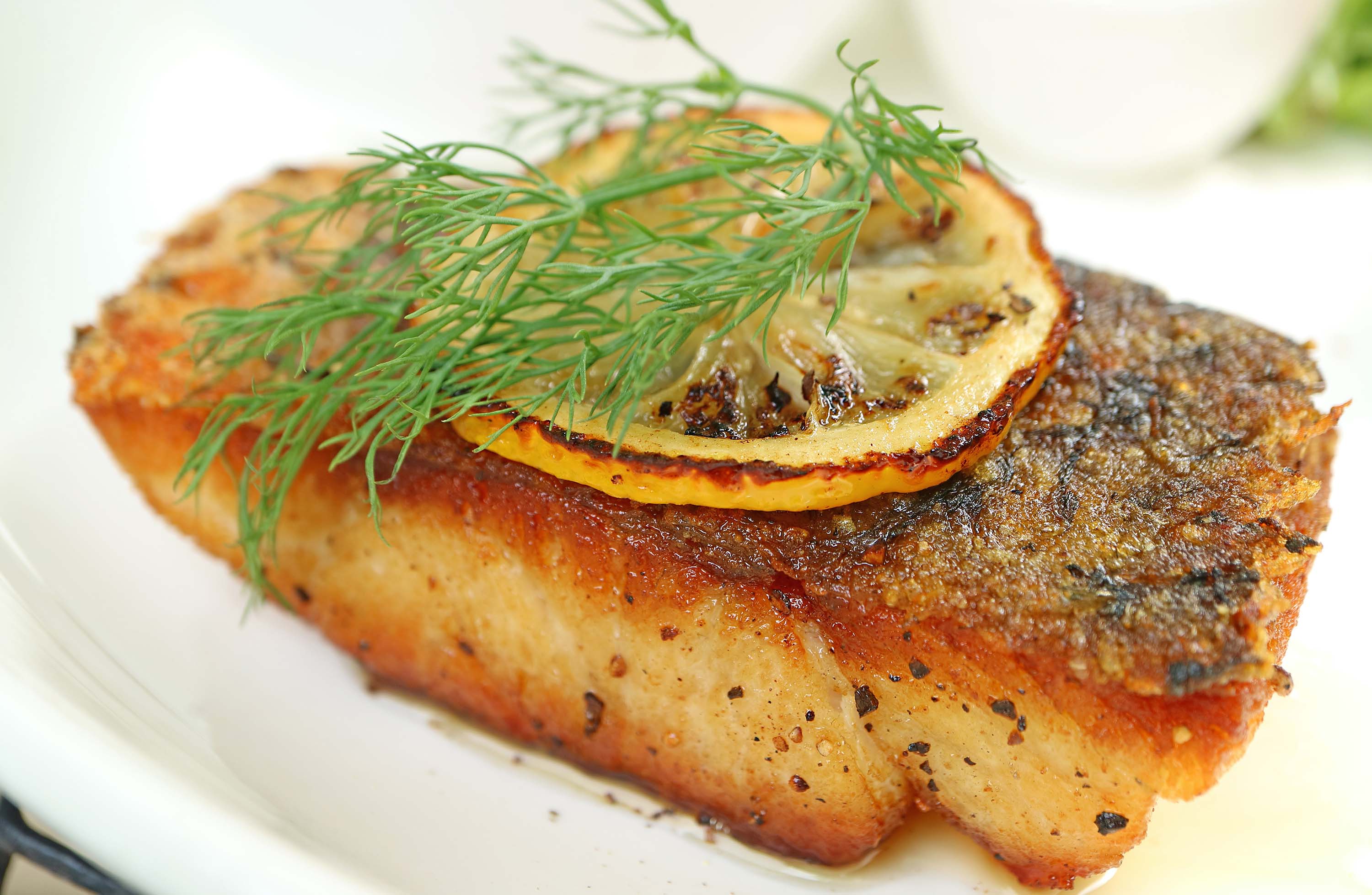 Stock photo of pan seared seabass. Credit: jobi_pro, Adobe Stock