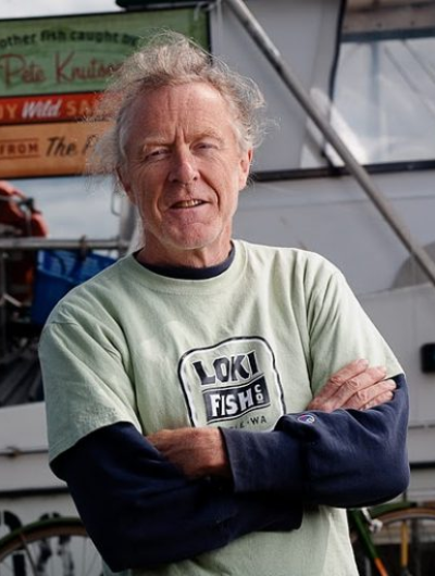 Pete Knutson poses with arms crossed in front of Loki Fish Company