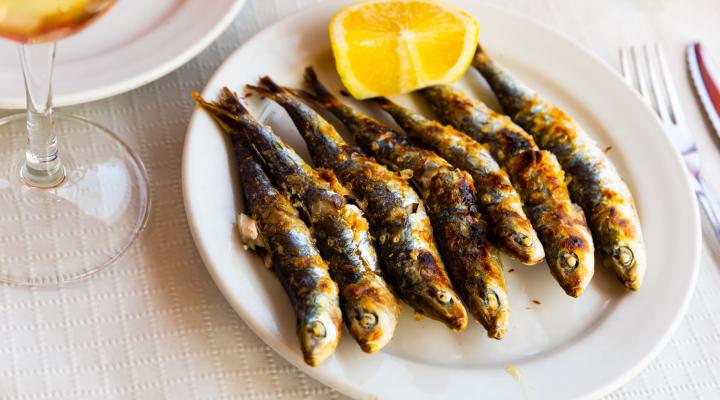 Stock photo of grilled sardines. Credit: JackF, Adobe Stock