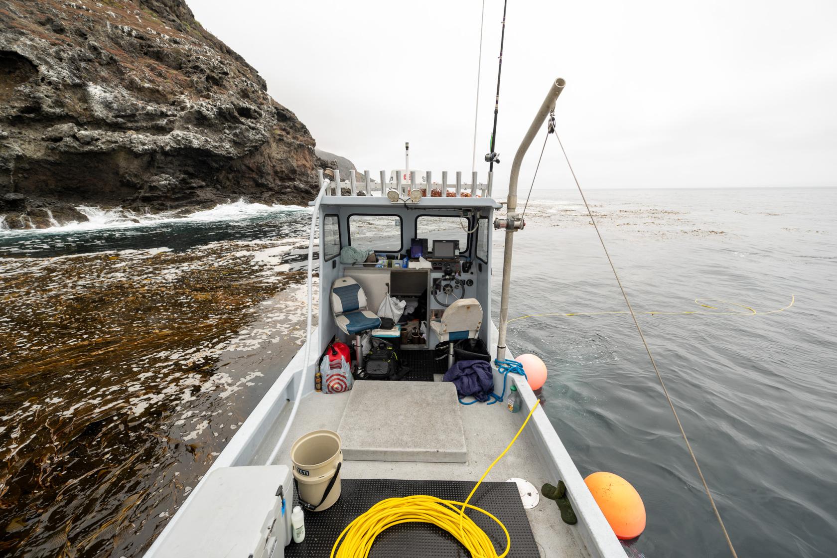 Commercial dive vessel near island