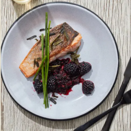 Salmon with crushed blackberries and seaweed